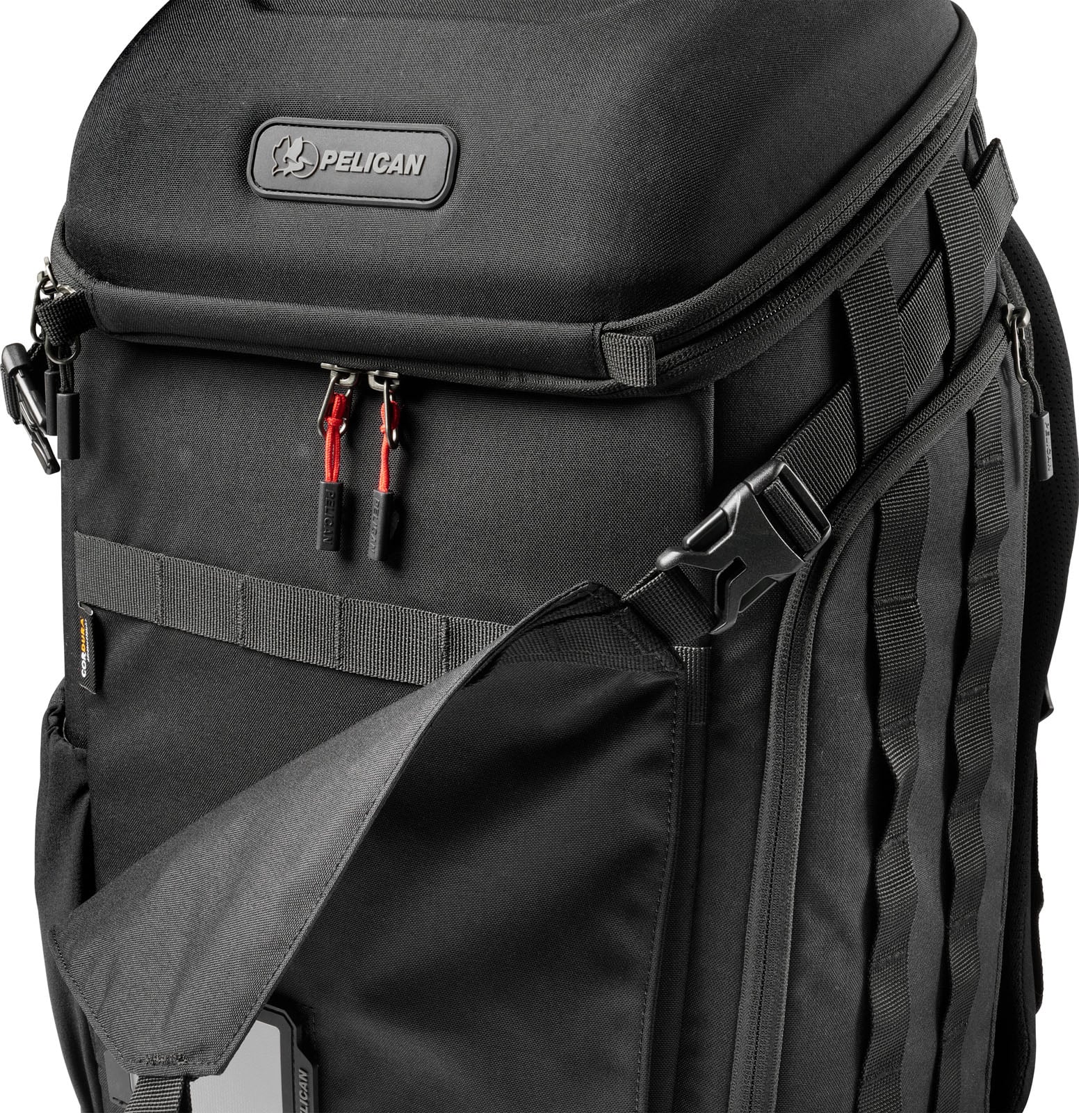 A black Pelican backpack featuring a top compartment, red zipper pulls, and a partially open front pocket with a visible logo.