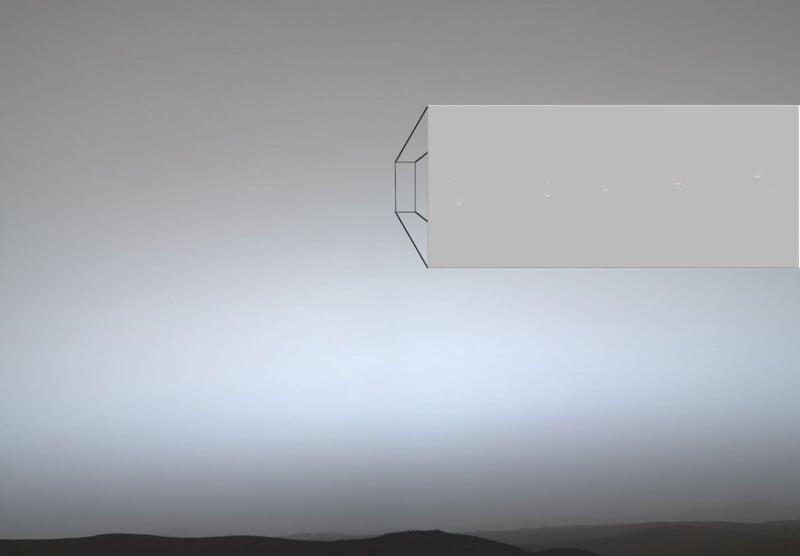 A hazy, light-colored sky over a dark horizon features a rectangular inset showing a sequence of five small, glowing orbs.