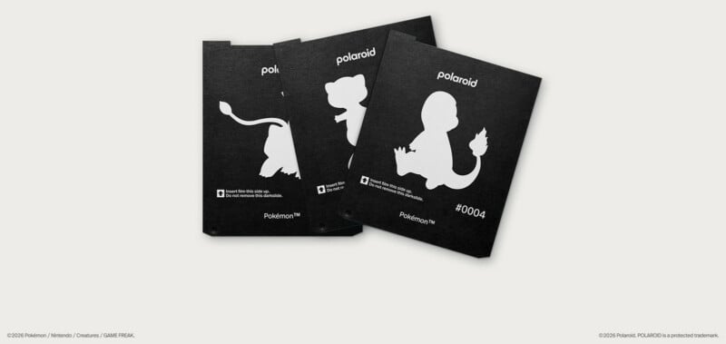 Three black Polaroid film darkslides are fanned out, each featuring a white silhouette of a Pokémon and the Polaroid logo.