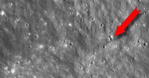 A side-by-side comparison of the lunar surface showing a new impact crater on the right, highlighted by a red arrow.