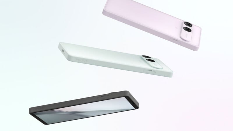 Three Sony Xperia smartphones in light purple, light green, and black are arranged diagonally against a white background.