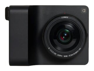 A black, minimalist digital camera with a prominent lens featuring text that reads LUMIX, G 1:1.7/20 ASPH., and 0.2m/0.66ft-∞.