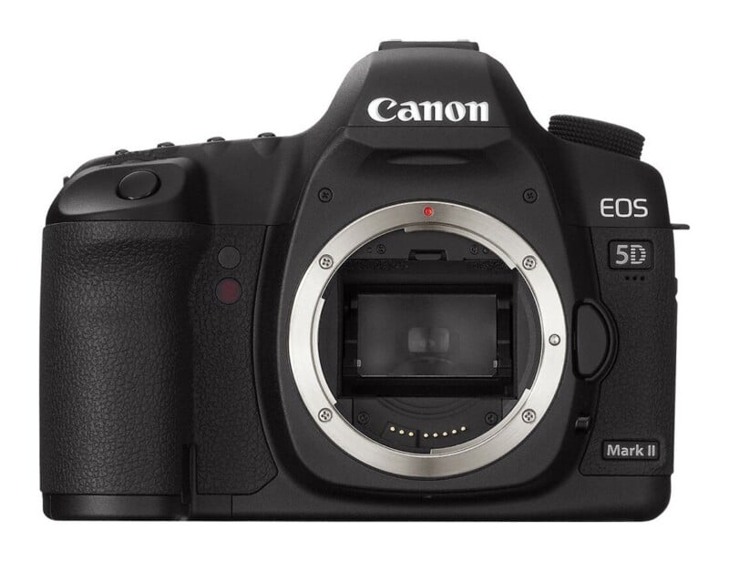 Front view of a black Canon EOS 5D Mark II DSLR camera body without a lens attached.