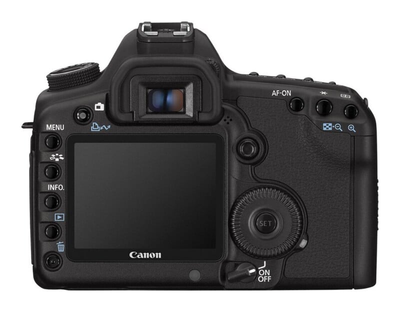 The back view of a black Canon DSLR camera showing the LCD screen, viewfinder, various control buttons, and the power switch.