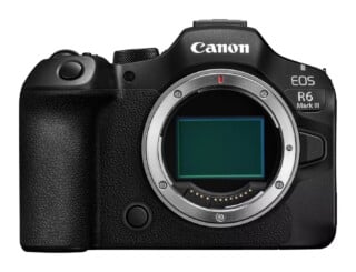 Front view of a black Canon EOS R6 Mark III mirrorless camera body with the lens detached, revealing the sensor.