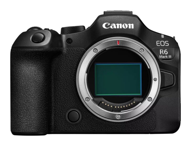 Front view of a black Canon EOS R6 Mark III mirrorless camera body with the lens detached, revealing the sensor.