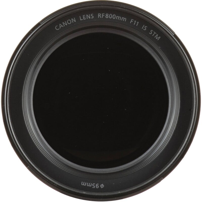 The front element of a Canon RF 800mm F11 IS STM lens, showing the black glass and the 95mm filter thread size printed on the rim.