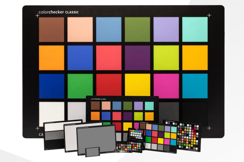 A collection of various sizes of Calibrite ColorChecker color calibration charts arranged on a white background.