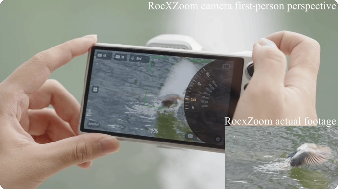 A person holds a digital camera displaying a bird on the water, with an inset showing the corresponding footage.