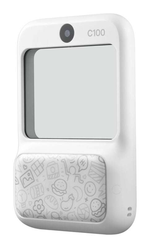 A white, rectangular digital camera with a lens at the top, a large screen, and a patterned lower panel featuring various icons.