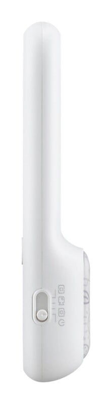 A side view of a white, handheld electronic device featuring a sliding power switch with four icons indicating different settings.
