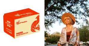 A box of Harman Phoenix ISO 125 colour film next to a portrait of a woman wearing a wide-brimmed hat and a patterned shirt.