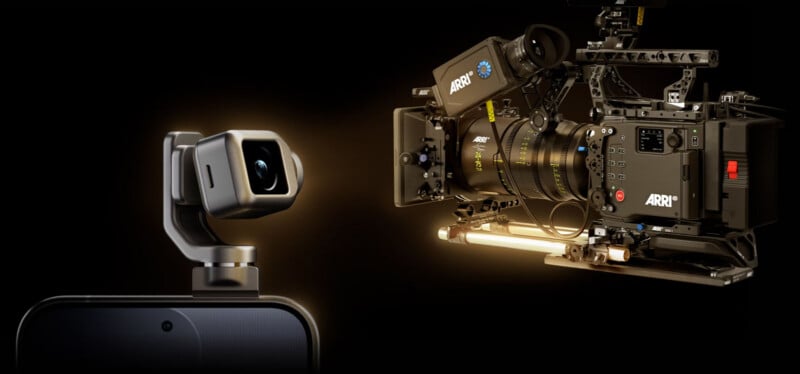A small, gimbal-mounted camera attached to a smartphone faces a large, professional cinema camera rig against a black background.