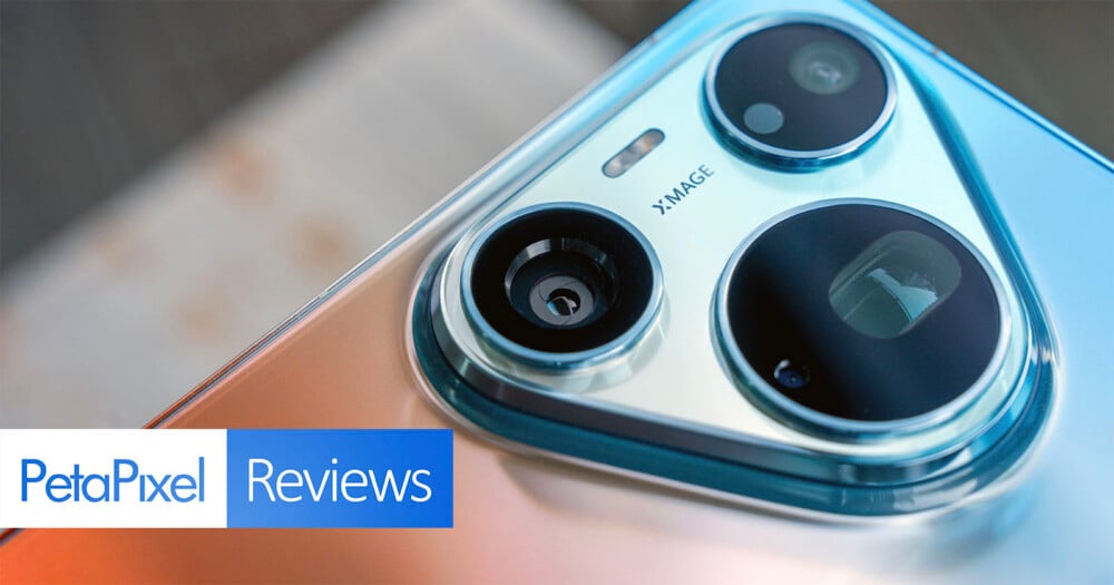 A close-up view of a smartphone camera module with three lenses and the text "XMAGE" printed on the metallic housing, with a "PetaPixel Reviews" logo in the bottom left corner.