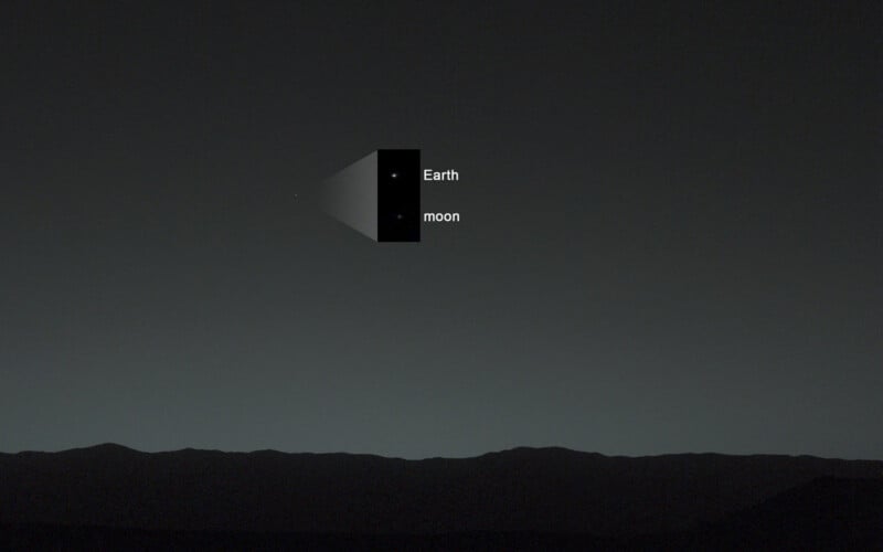 A view of the night sky from a dark horizon, with an inset box highlighting Earth and the Moon as two small, bright dots.