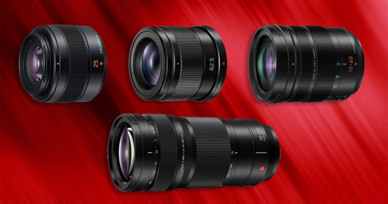 Four camera lenses are arranged against a red, motion-blurred background, with three smaller lenses positioned above a larger, longer lens.