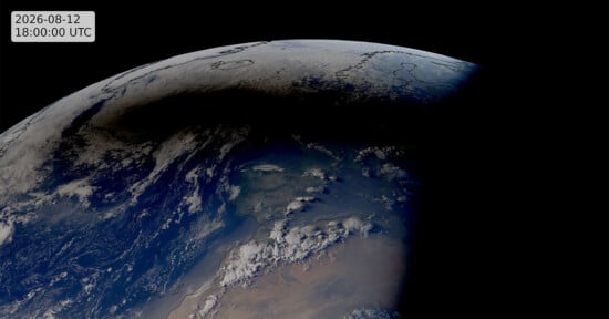 A satellite view of Earth on August 12, 2026, showing the moon's shadow cast across parts of Europe and the Atlantic Ocean.