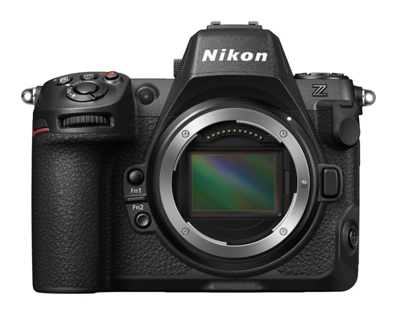 A front-facing view of a black mirrorless camera body with an exposed sensor, featuring a Nikon logo on the prism housing and a Z mount.