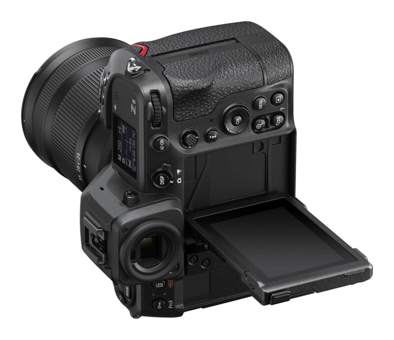A Nikon Z 8 mirrorless camera with a lens attached, shown from a rear-angle view with its LCD screen tilted outward.