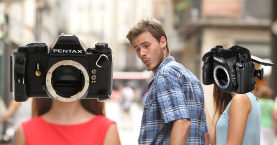 A man in a plaid shirt walks down a street, looking back at a woman with a Pentax K-1 Mark II camera for a head, while ignoring a woman with a vintage Pentax film camera for a head.