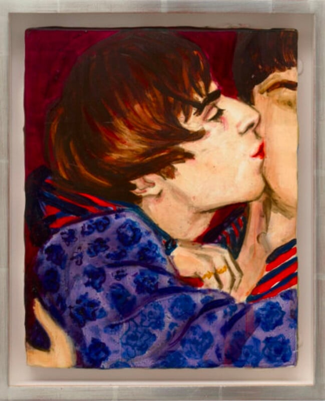 An oil painting depicts a close-up of a person with dark hair in a bowl cut kissing another person on the cheek, wearing a purple floral-patterned jacket.