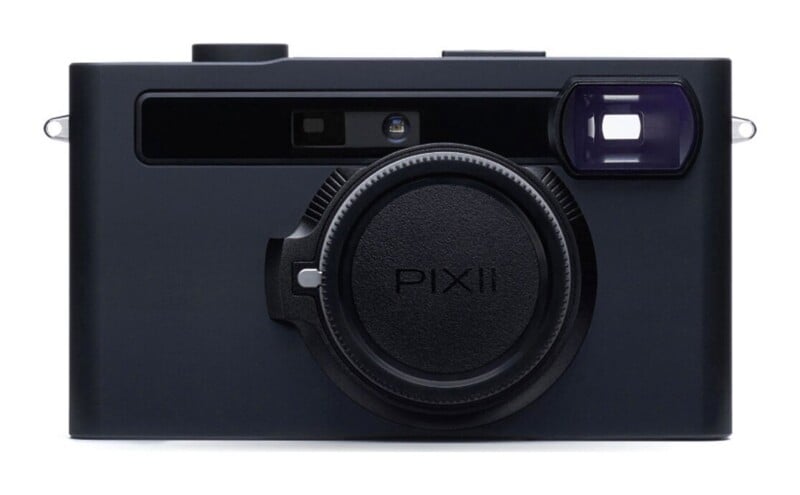 A black digital rangefinder camera with a lens cap labeled PIXII centered on the front body.