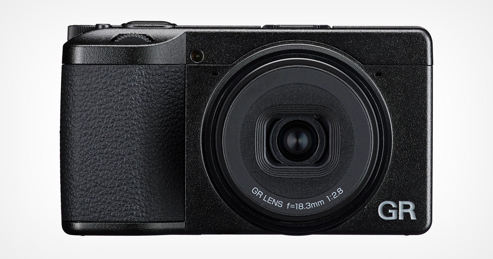A front-facing view of a black compact digital camera with a prominent lens barrel labeled "GR LENS f=18.3mm 1:2.8" and "GR" branding.
