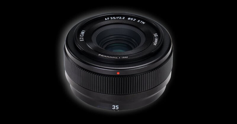 A black camera lens with a 35mm focal length, f/2.2 aperture, and 52mm filter thread, set against a solid black background.