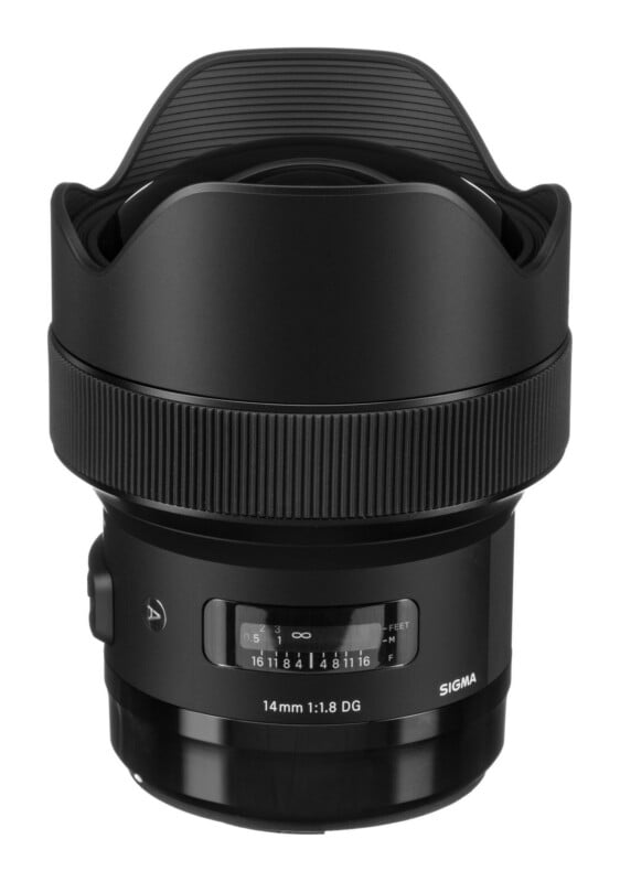 A black Sigma 14mm 1:1.8 DG camera lens with a built-in lens hood, featuring a focus distance scale and aperture markings on the barrel.