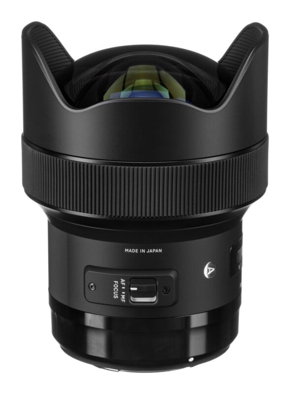 A black wide-angle camera lens with a prominent, bulbous front element, a focus mode switch, and a small "A" logo on the side.