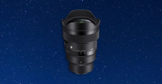 A black Sigma 14mm 1:1.4 DG DN camera lens centered against a dark blue background filled with white stars.