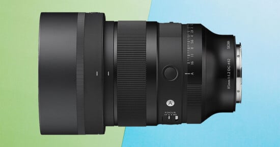 A black Sigma 85mm 1:1.2 DG lens is shown against a split green and blue background.