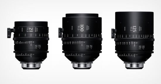 Three black cinema lenses of varying sizes, labeled 21, 100, and 125, are arranged side-by-side against a white background.