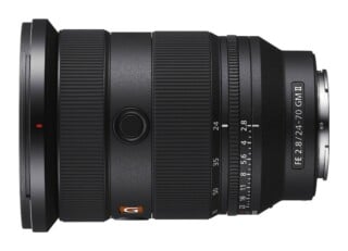 A black Sony FE 24-70mm f/2.8 GM II camera lens shown from the side, featuring a zoom ring, focus ring, and aperture ring.