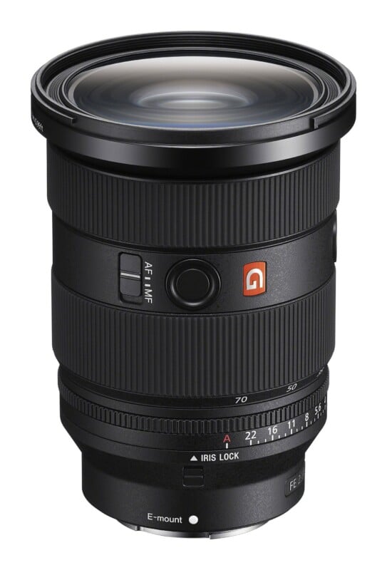 A black Sony FE 2.8 camera lens with an E-mount, featuring an iris lock ring, focus mode switch, and a G-Master logo.