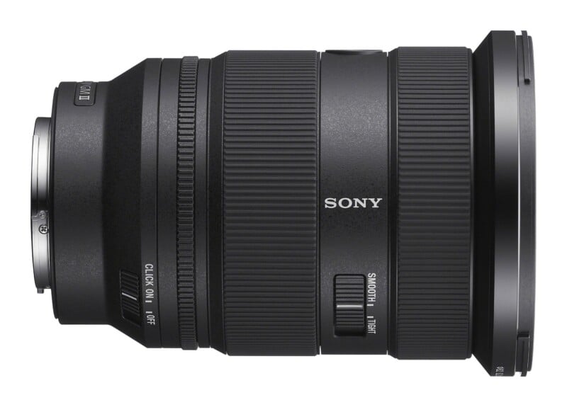 A black Sony camera lens shown from the side, featuring a zoom ring, a focus ring, a click switch, and a smooth-tight zoom adjustment switch.