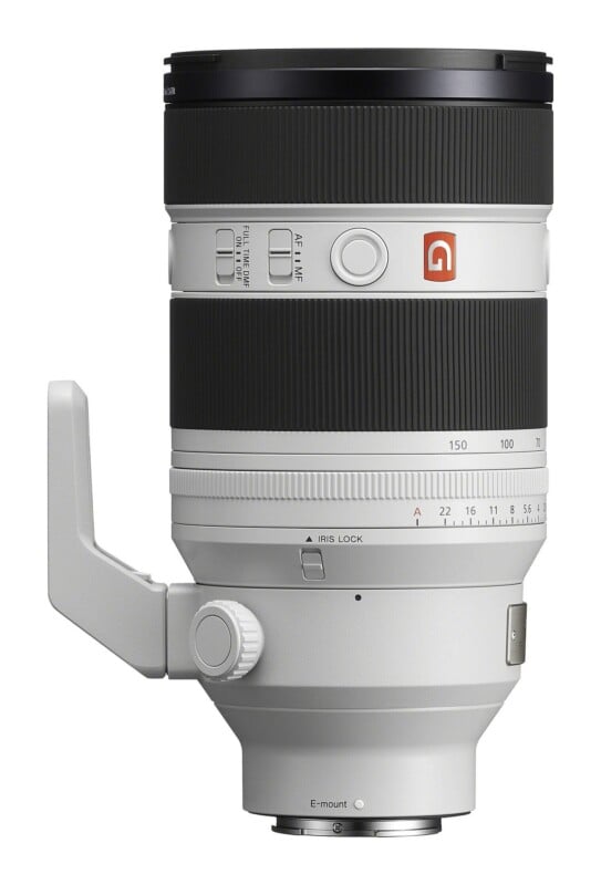 A white Sony G Master telephoto zoom lens with a tripod mount, aperture ring, and focus controls, shown against a white background.