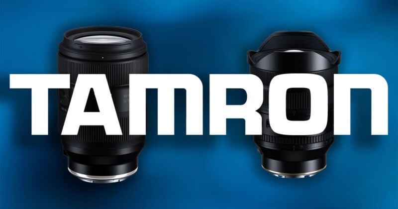 Two camera lenses are positioned against a blue background with the word TAMRON written in large white letters across the center.