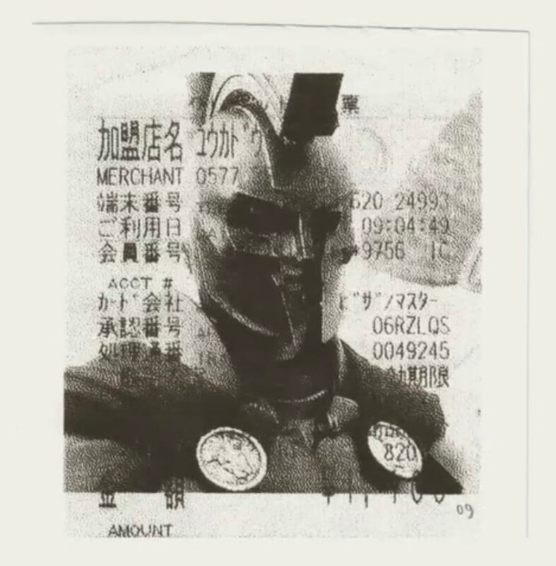 A grainy, black-and-white image of a Spartan warrior in a helmet superimposed over a Japanese credit card transaction receipt.