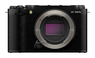 Front view of a black mirrorless camera body with an exposed sensor, a lens mount, and the text "X-M5" printed on the top right.