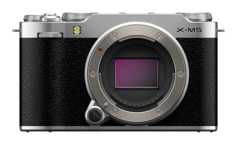 A front-facing silver and black mirrorless camera body with an exposed sensor and the text X-M5 printed on the top right.