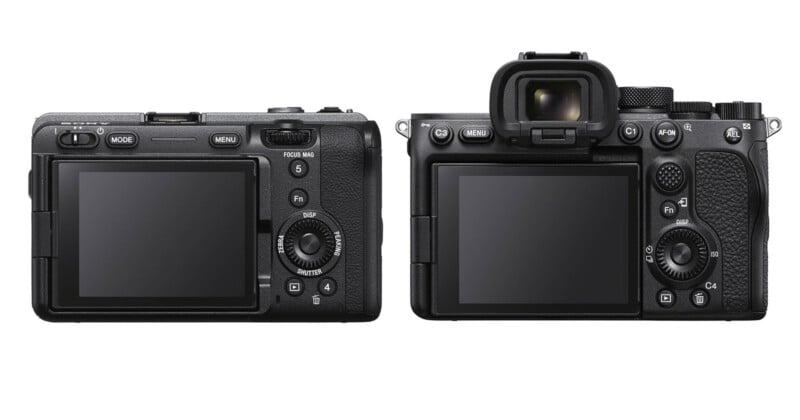 Two black digital cameras shown from the rear, with the one on the left lacking a viewfinder and the one on the right featuring an electronic viewfinder.