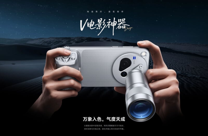 A pair of hands holds a silver smartphone equipped with a large, protruding camera lens attachment against a dark, starry desert background.