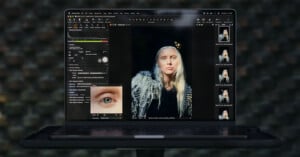 A laptop screen displays the Capture One software interface, showing a portrait of a blonde woman and a close-up focus tool of her eye.