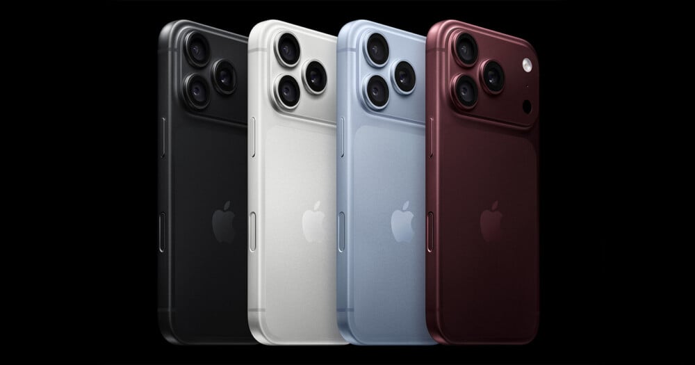 Four smartphones in black, white, light blue, and dark red are arranged in a row against a black background, each featuring a triple-lens camera array.