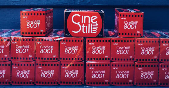 A stack of red CineStill 800T 35mm film boxes arranged in three rows against a dark blue background.