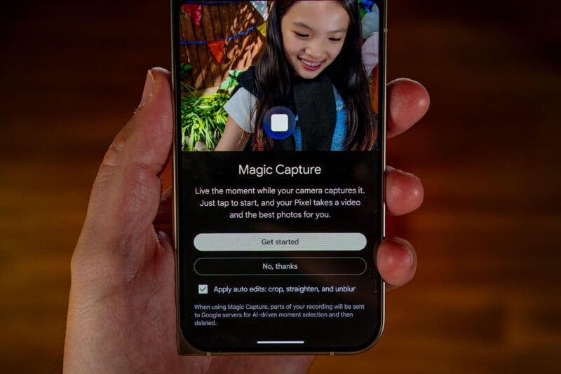A hand holds a smartphone displaying a "Magic Capture" feature screen with options to get started, decline, or enable auto-edits.