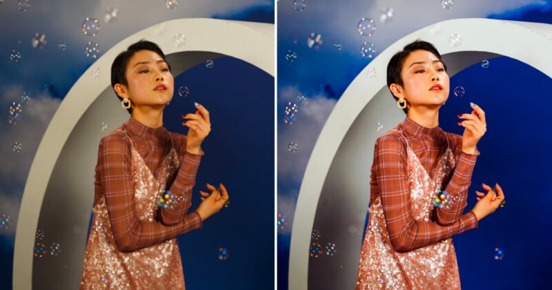 A person with short dark hair wearing a plaid long-sleeved top and a sequined dress poses in front of a circular archway surrounded by floating bubbles.