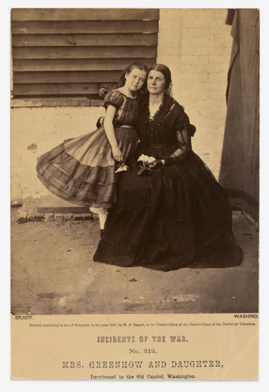 A sepia-toned portrait of Rose O'Neal Greenhow and her daughter, Rose, sitting together in the Old Capitol Prison in 1862.