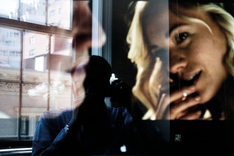 A double exposure shows a person holding a camera in front of a window, overlaid with a close-up portrait of a smiling woman.